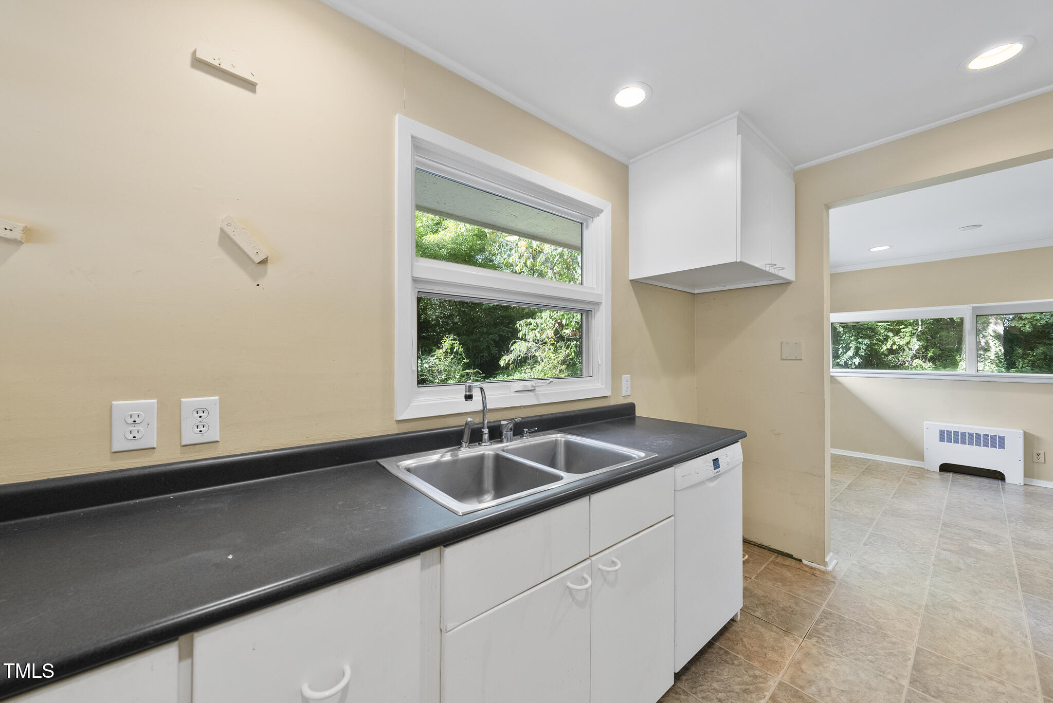 825 Woodburn Road Raleigh, NC 27605 - Photo 18 of 35 a kitchen with a sink and a window