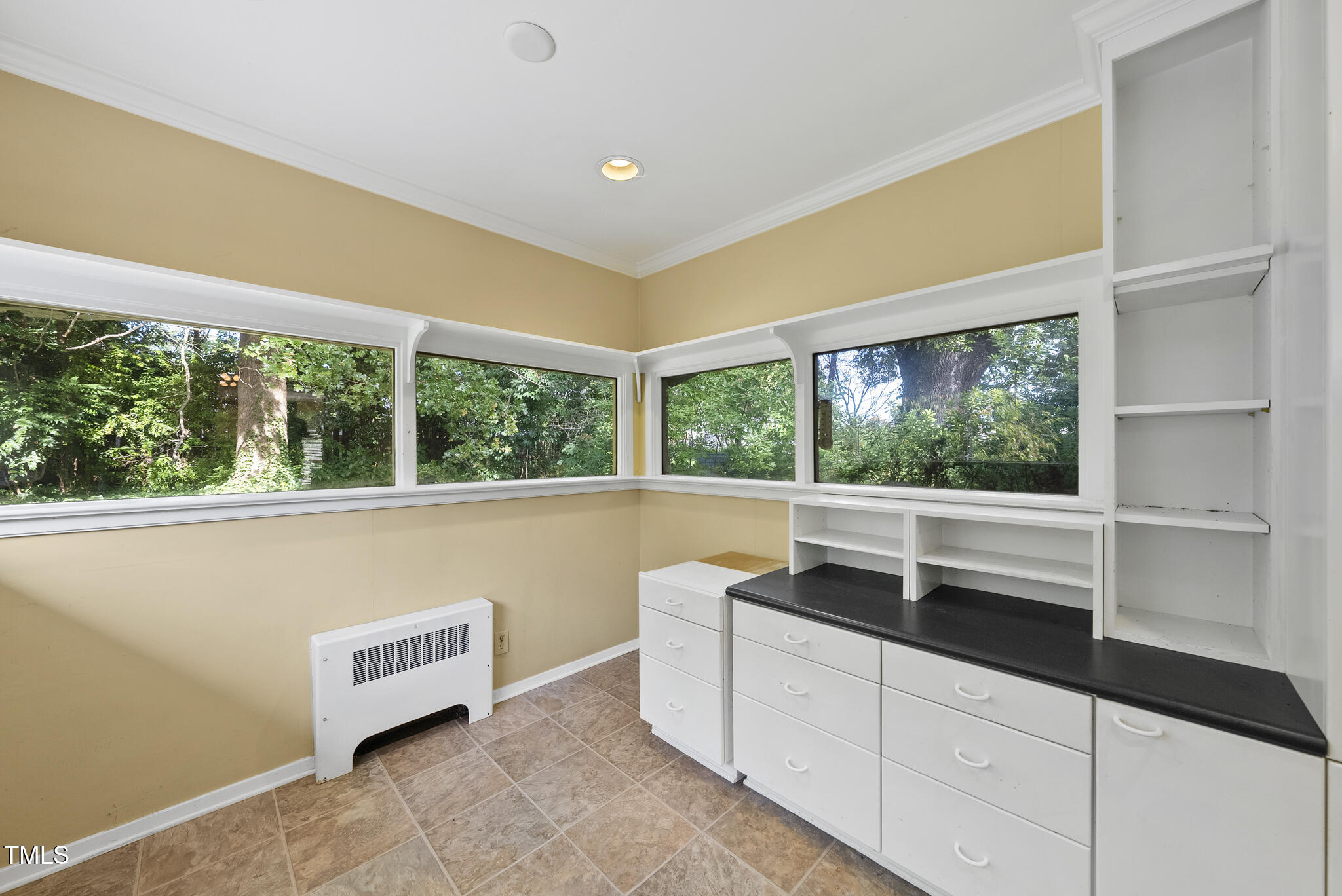 825 Woodburn Road Raleigh, NC 27605 - Photo 22 of 35 a room with a large window and pool