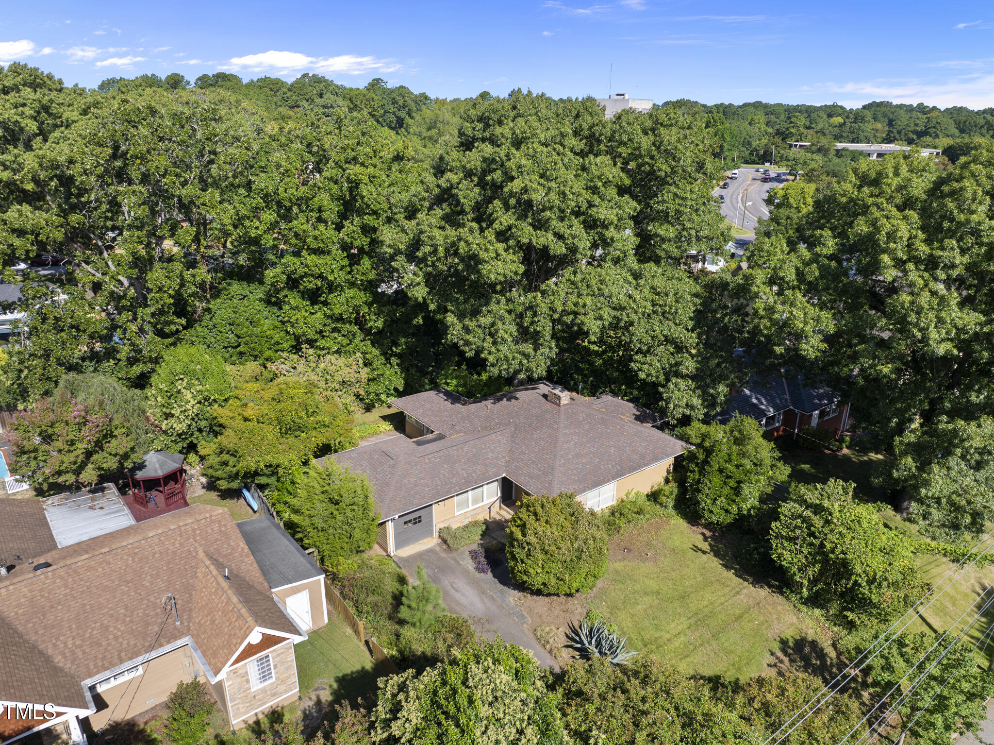 825 Woodburn Road Raleigh, NC 27605 - Photo 2 of 35 an aerial view of a house with yard