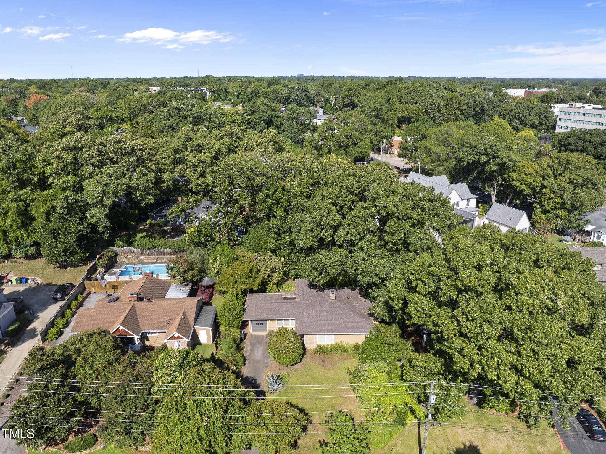 825 Woodburn Road Raleigh, NC 27605 - Photo 3 of 35 an aerial view of a house with a yard
