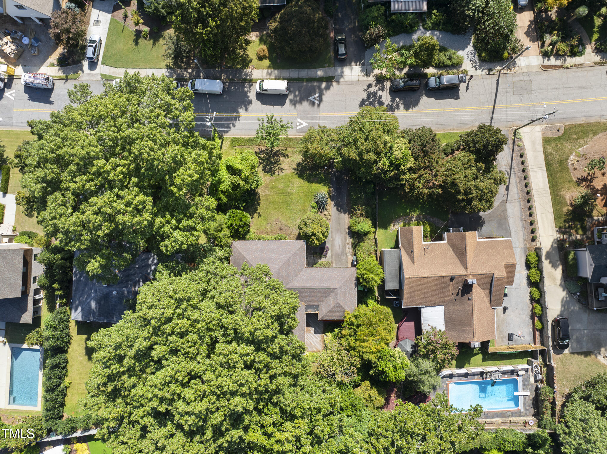 825 Woodburn Road Raleigh, NC 27605 - Photo 7 of 35 an aerial view of a house with a yard and garden