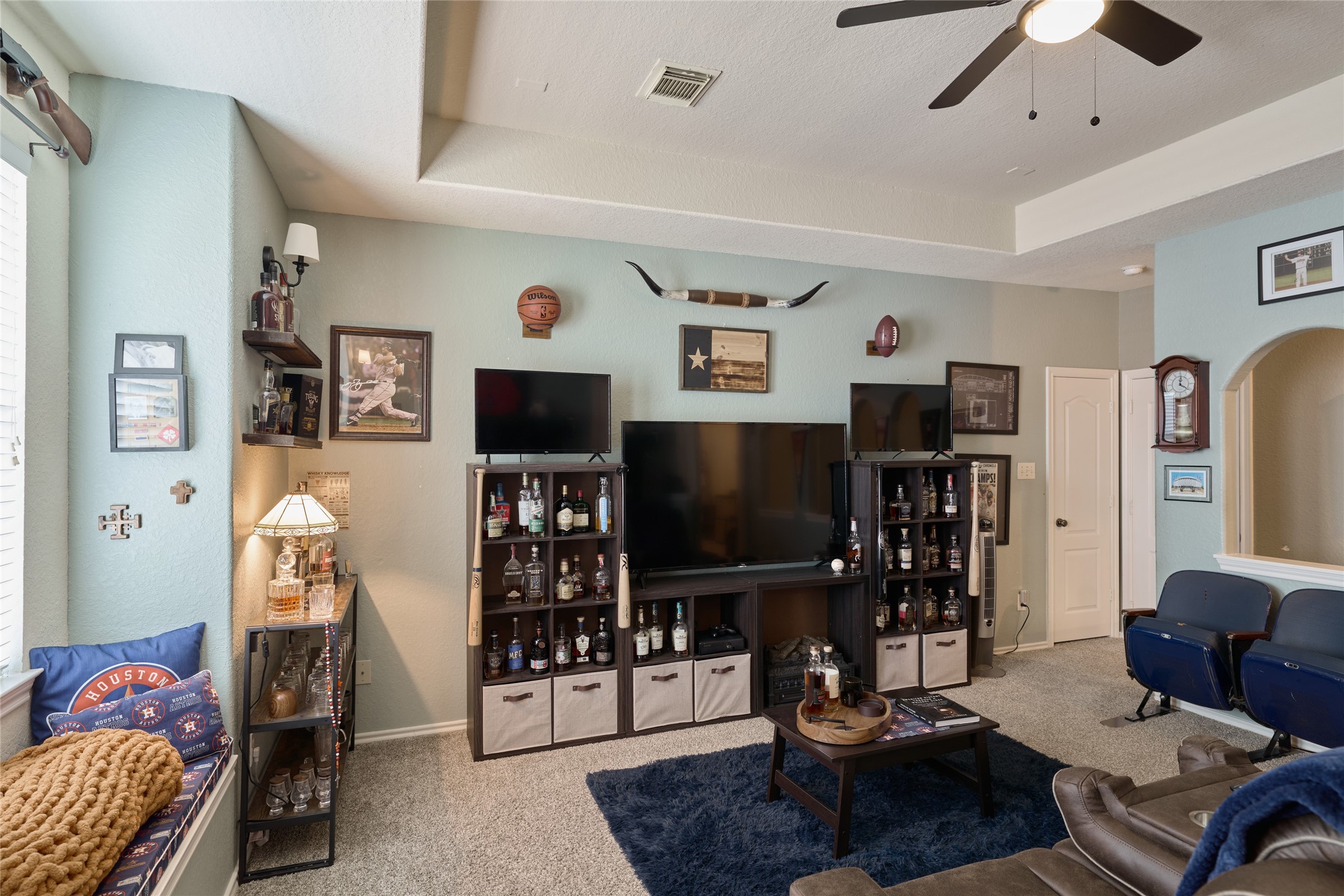 28322 Madelin Manor Lane Spring, TX 77386 - Photo 26 of 46 a living room with furniture and a flat screen tv