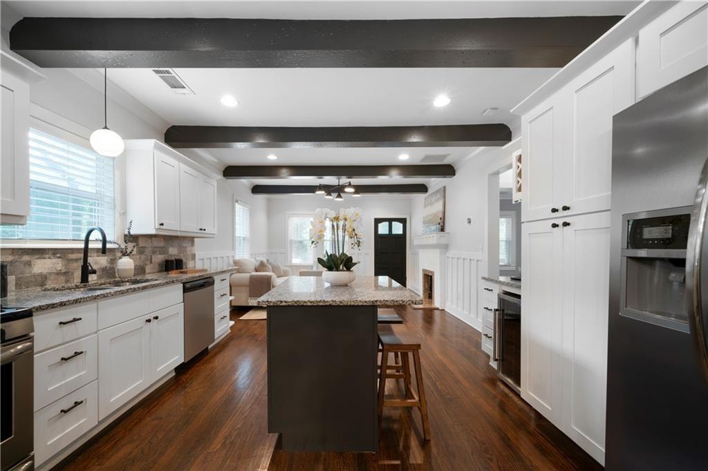 1045 Moreland Avenue Southeast Atlanta, GA 30316 - Photo 11 of 28 a kitchen with sink stove and refrigerator