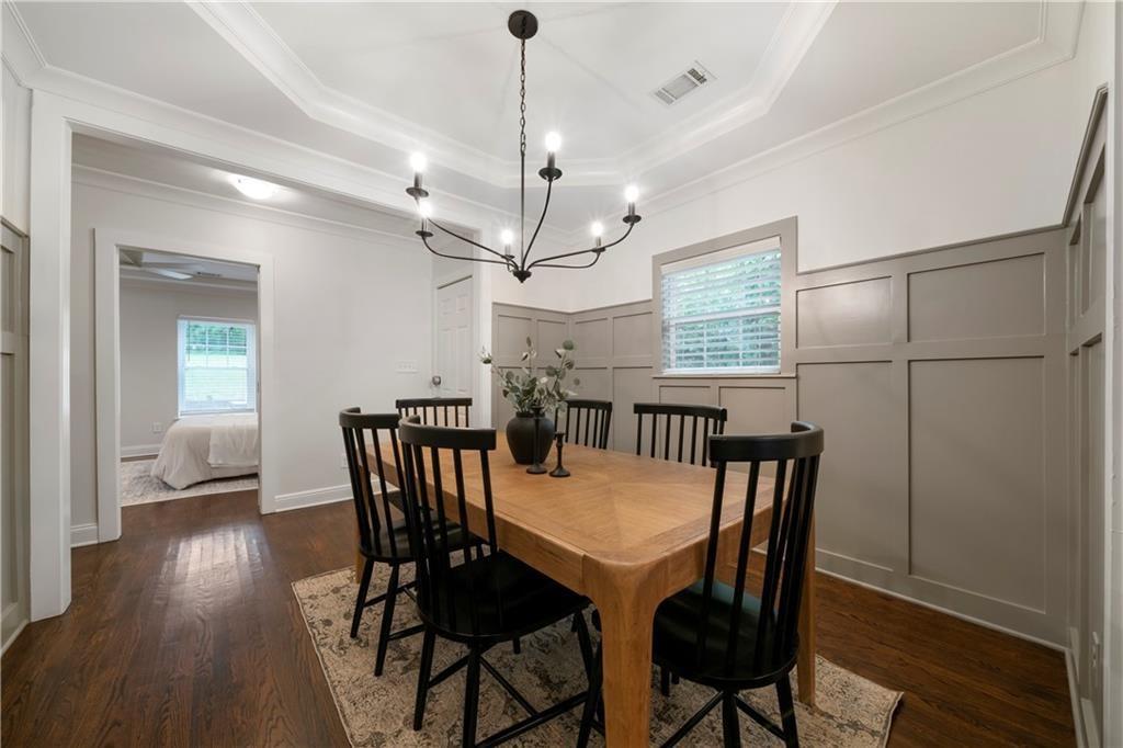 1045 Moreland Avenue Southeast Atlanta, GA 30316 - Photo 14 of 28 a view of a dining room with furniture window and wooden floor