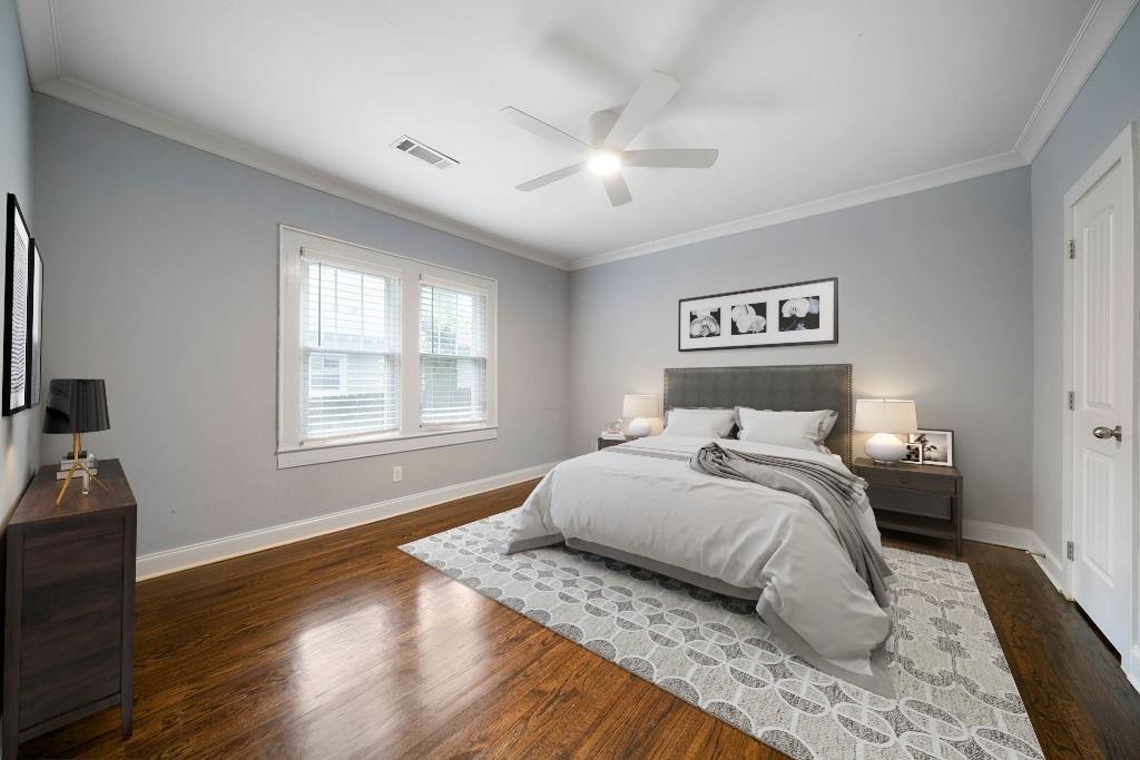 1045 Moreland Avenue Southeast Atlanta, GA 30316 - Photo 15 of 28 a bedroom with a large bed and a window
