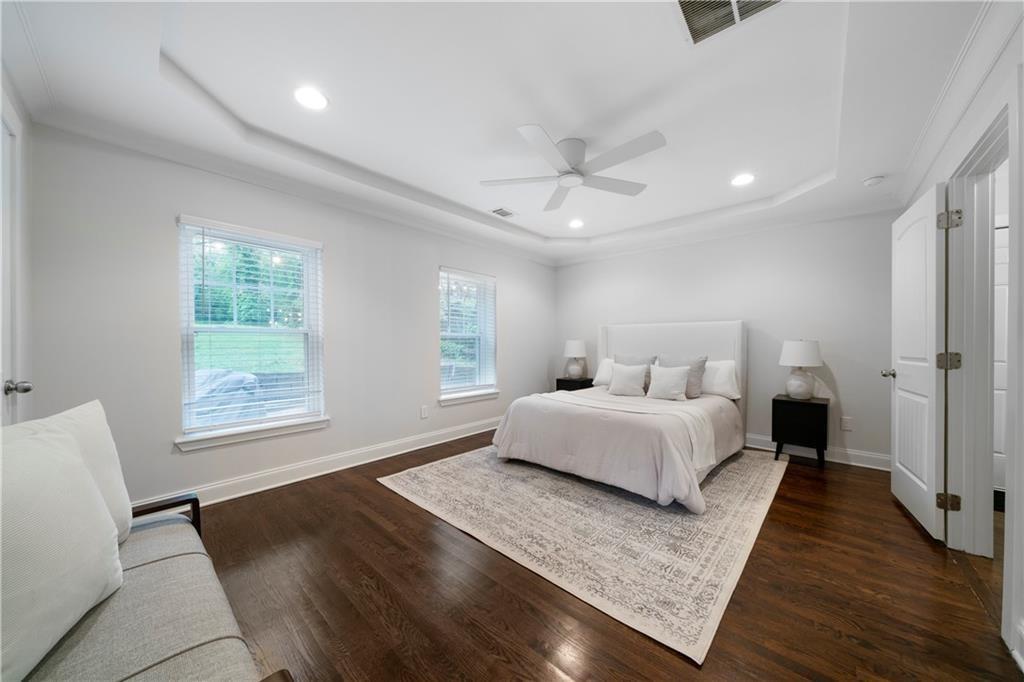 1045 Moreland Avenue Southeast Atlanta, GA 30316 - Photo 16 of 28 a spacious bedroom with a bed and a window