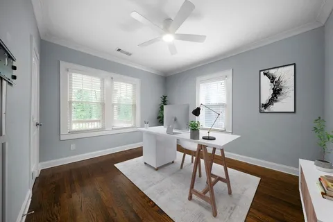 a workspace with furniture and a window