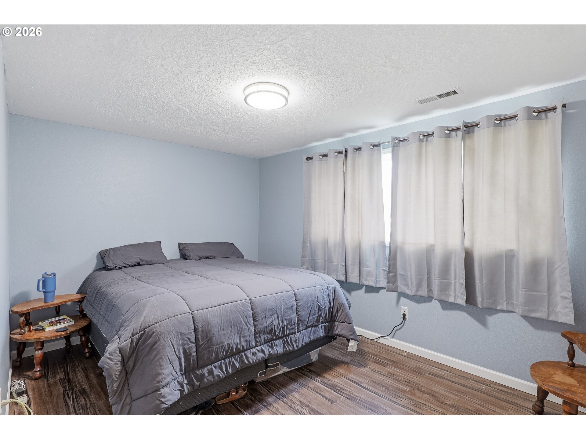 818 Chehalis Place North Keizer, OR 97303 - Photo 11 of 20 a bedroom with a bed and a window