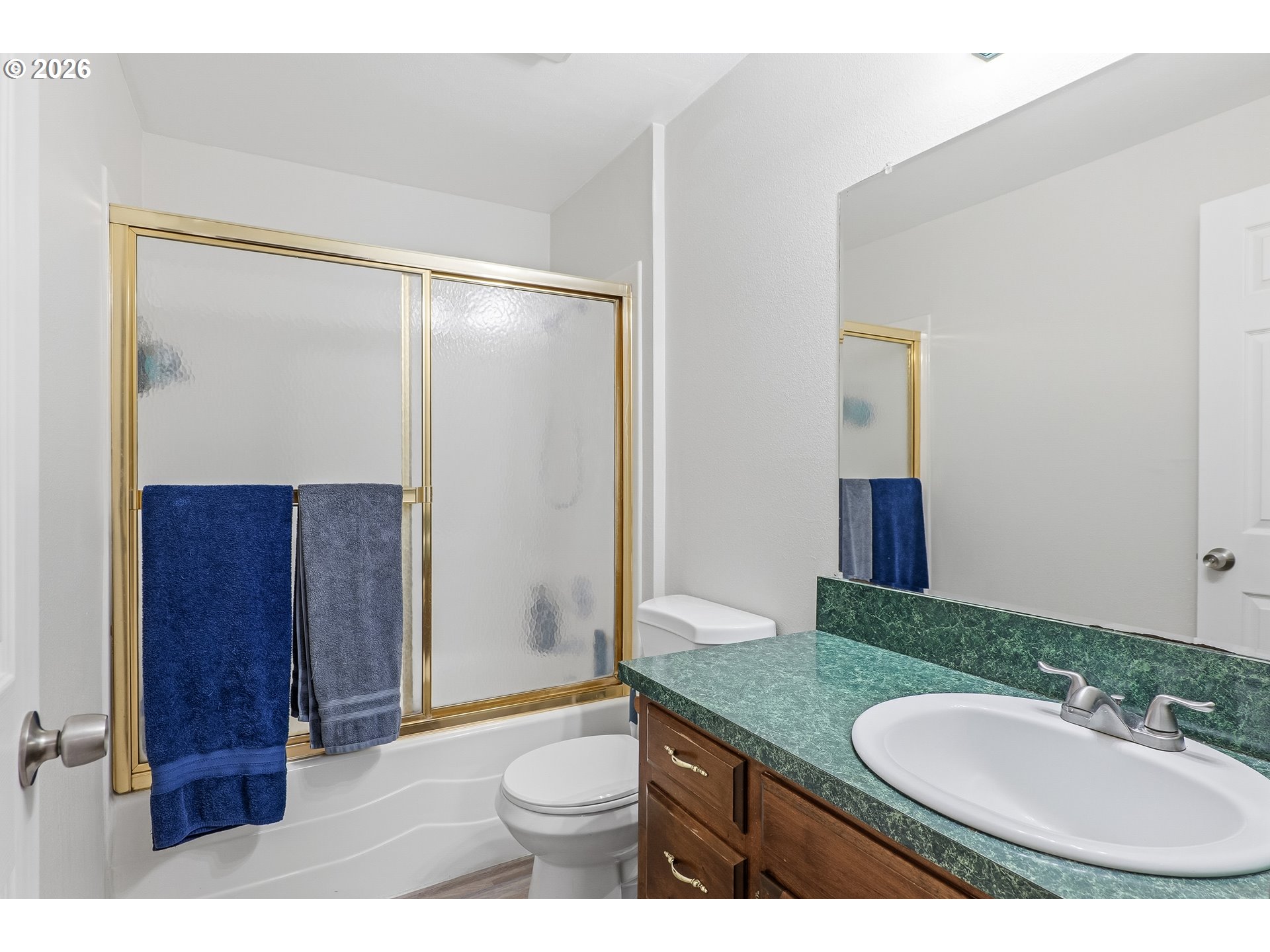 818 Chehalis Place North Keizer, OR 97303 - Photo 14 of 20 a bathroom with a granite countertop sink toilet a mirror and shower