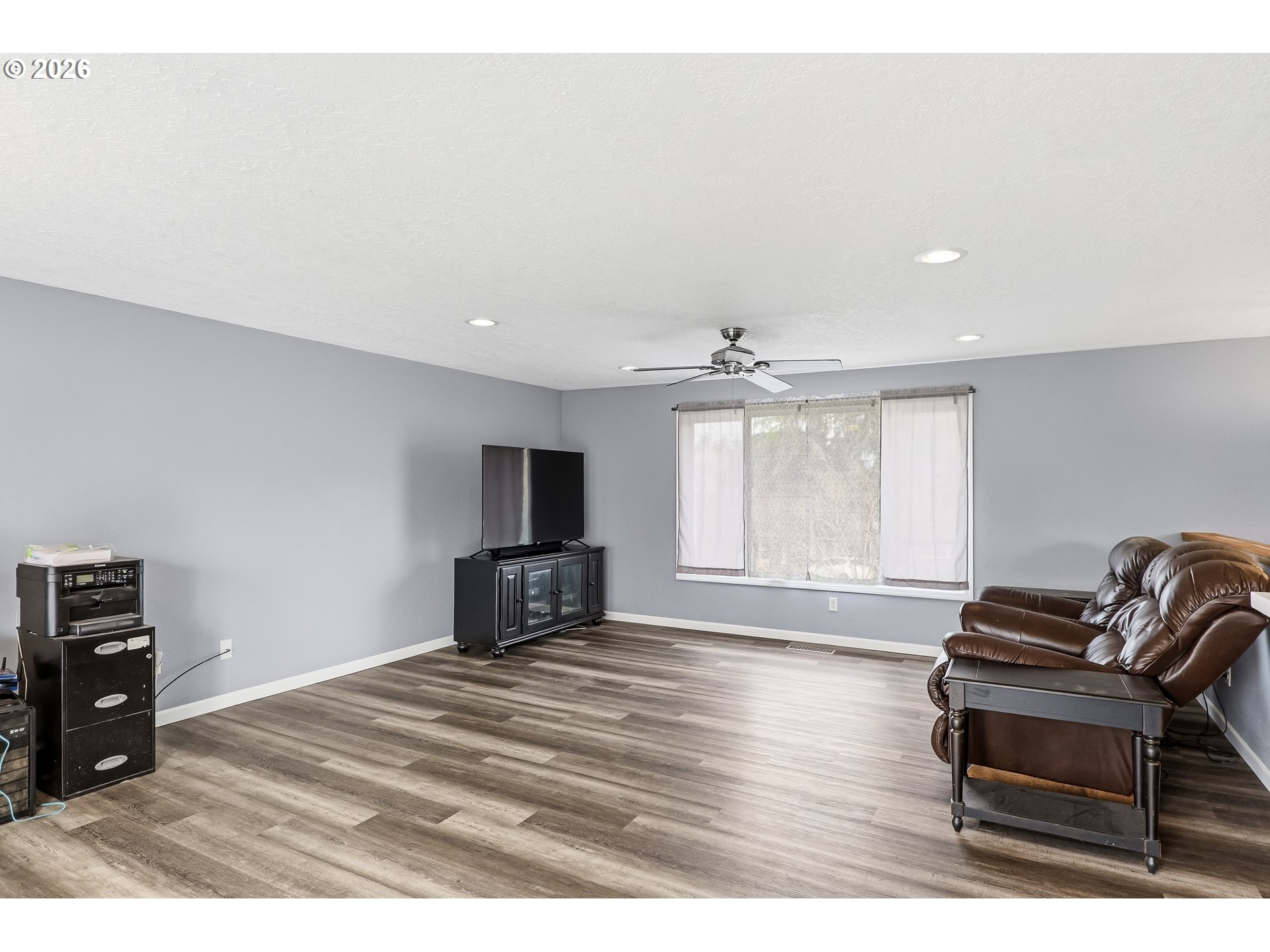 818 Chehalis Place North Keizer, OR 97303 - Photo 3 of 20 a living room with furniture a flat screen tv and a window