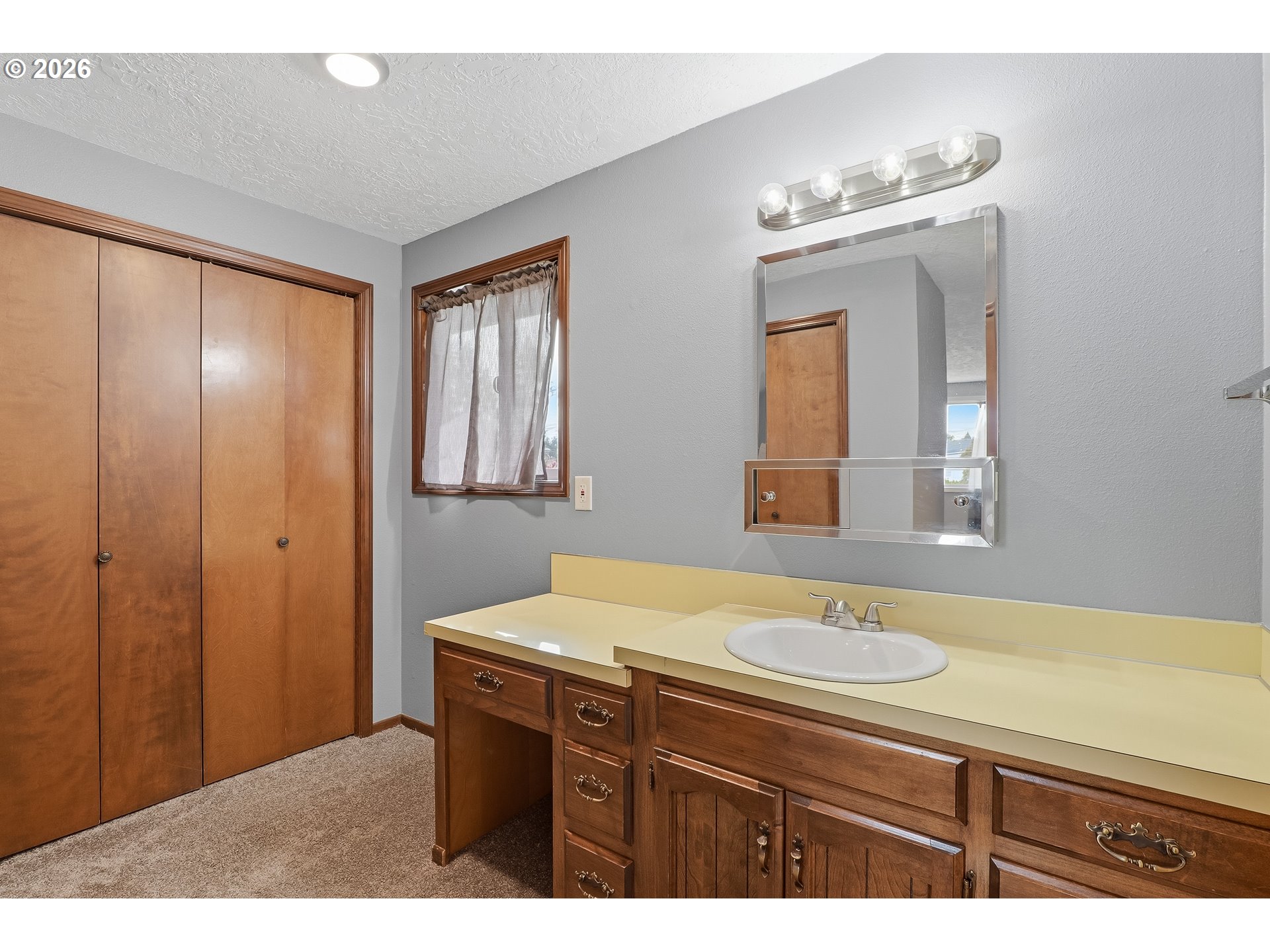 818 Chehalis Place North Keizer, OR 97303 - Photo 9 of 20 a bathroom with a sink vanity and a mirror