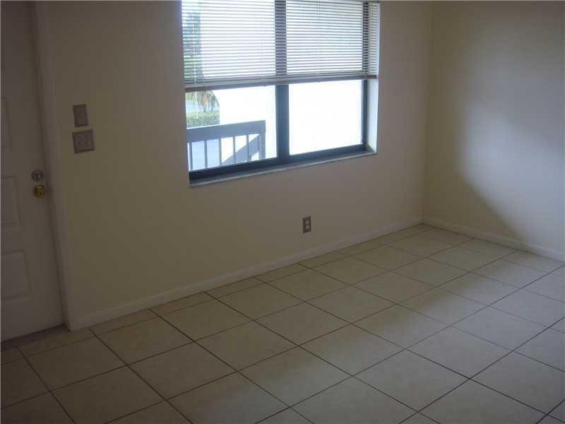 22465 Southwest 61st Way, Unit 243D Boca Raton, FL 33428 - Photo 5 of 10 an empty room with windows