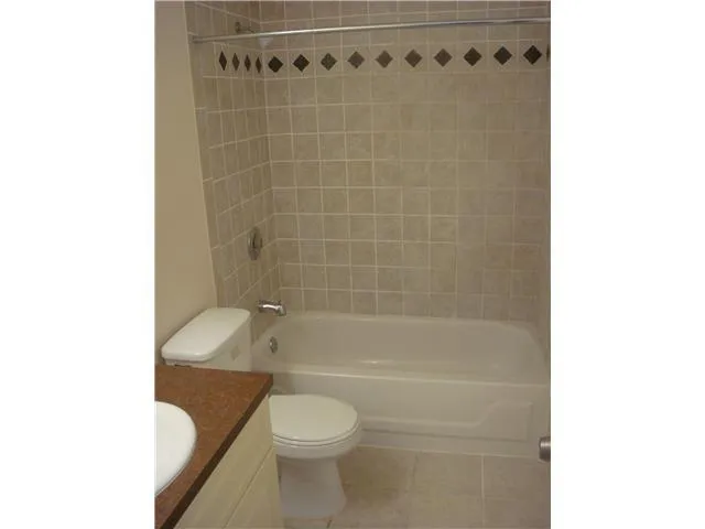 a bathroom with a toilet a sink and a bathtub