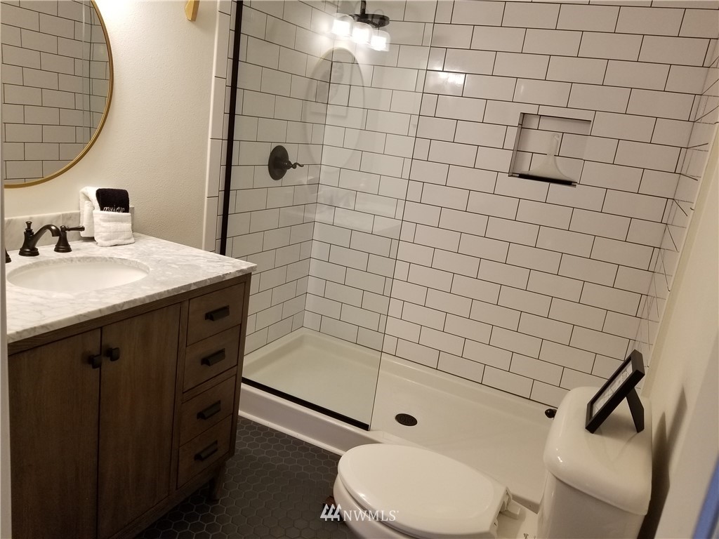 53718 State Rte 2 Gold Bar, WA 98251 - Photo 10 of 32 a bathroom with a sink toilet and shower