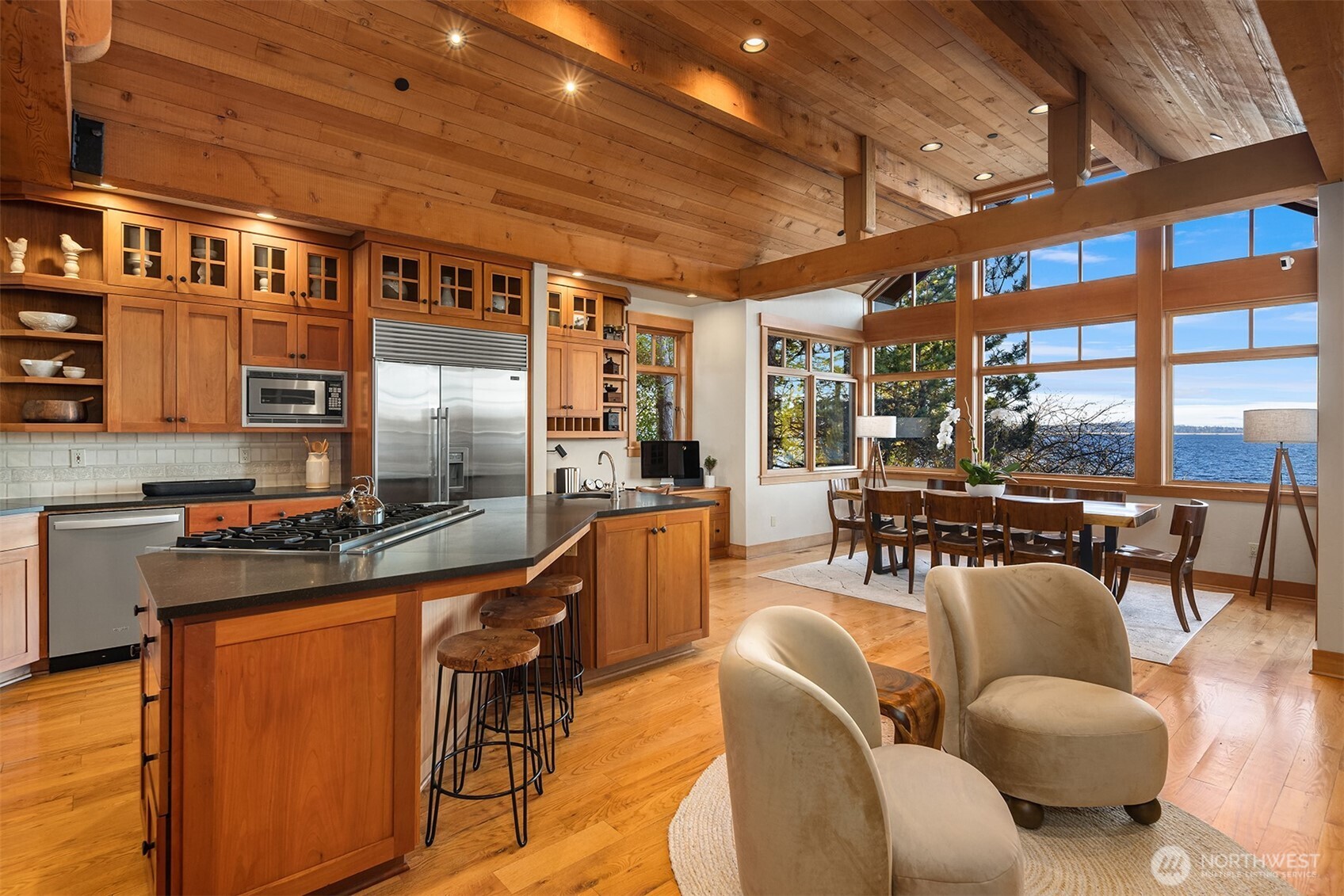 7010 North Mercer Way Mercer Island, WA 98040 - Photo 16 of 40 a living room with furniture a rug and a chandelier