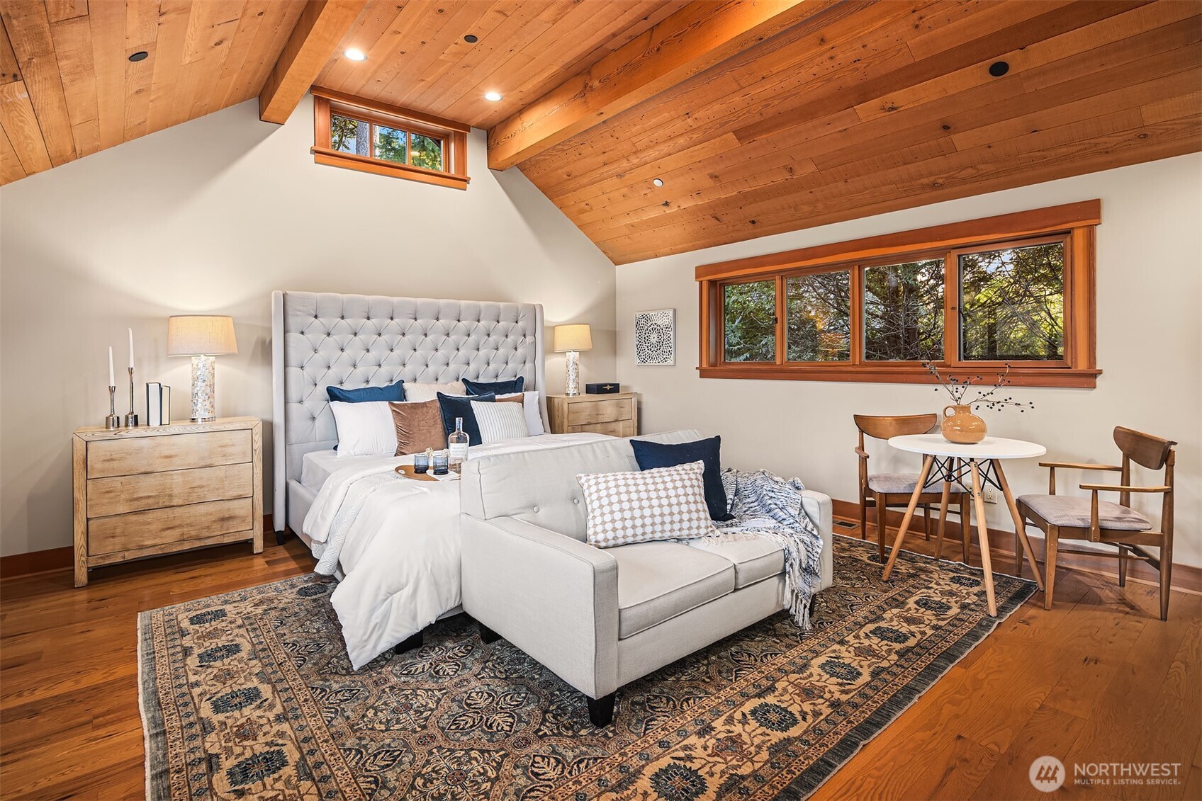 7010 North Mercer Way Mercer Island, WA 98040 - Photo 25 of 40 a bedroom with furniture and wooden floor