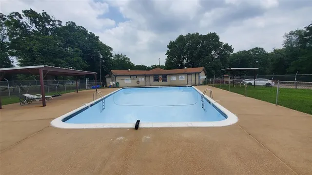a view of a swimming pool with a lounge chair