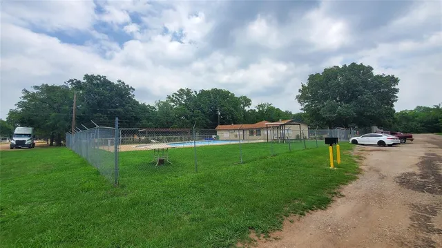 a view of a garden and swimming pool