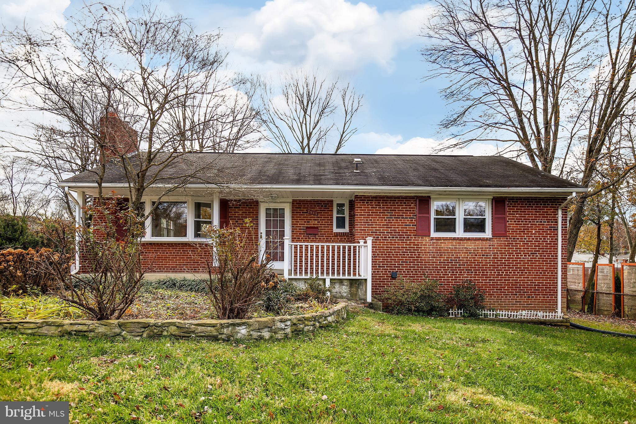 7515 Gresham Street Springfield, VA 22151 - Photo 2 of 36 a front view of a house with a yard