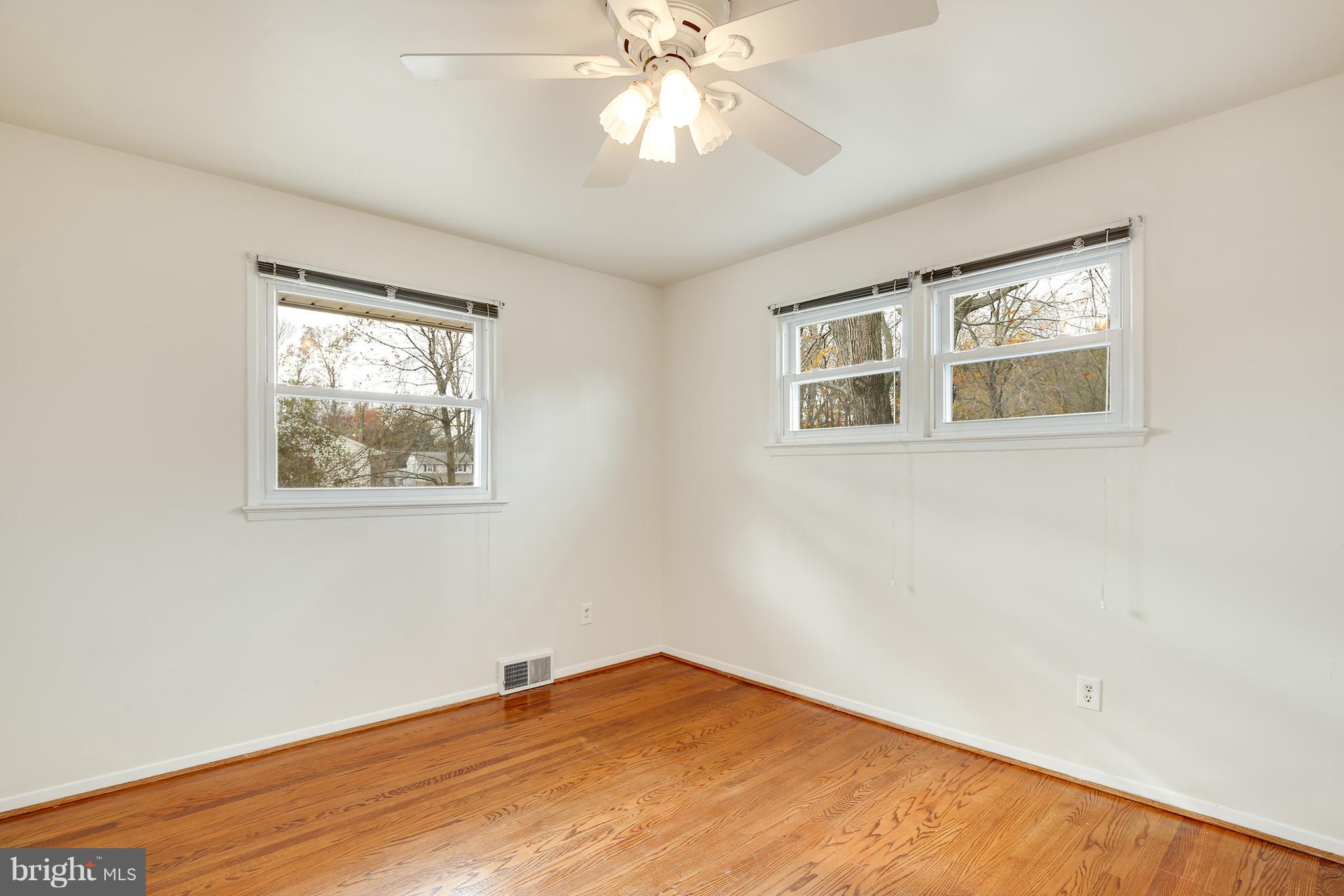 7515 Gresham Street Springfield, VA 22151 - Photo 14 of 36 a view of an empty room with a window