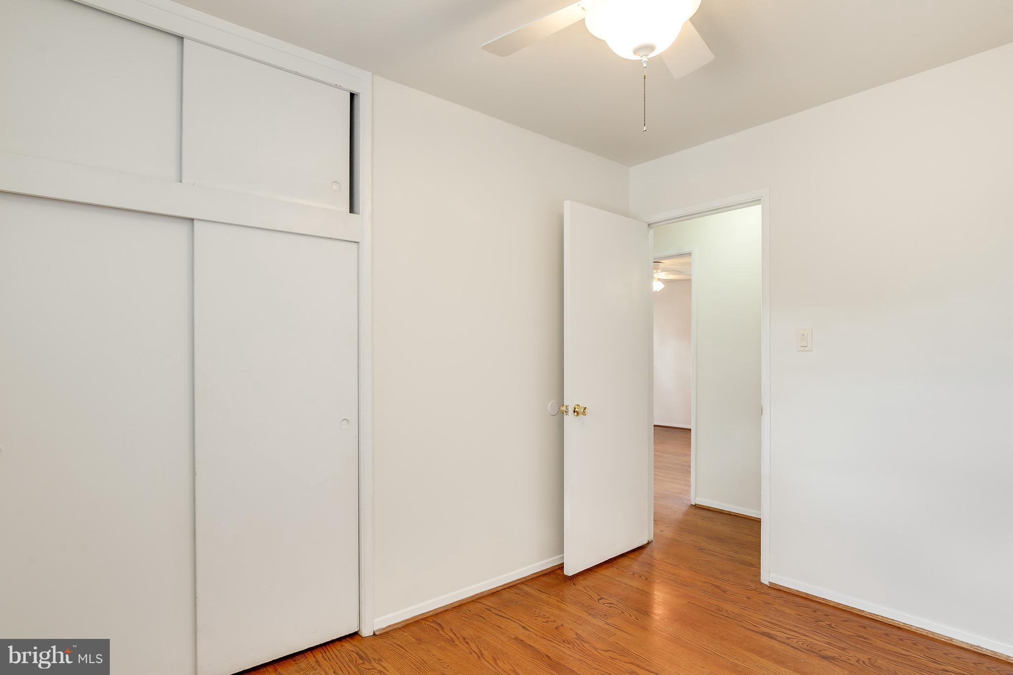 7515 Gresham Street Springfield, VA 22151 - Photo 16 of 36 a view of an empty room with wooden floor