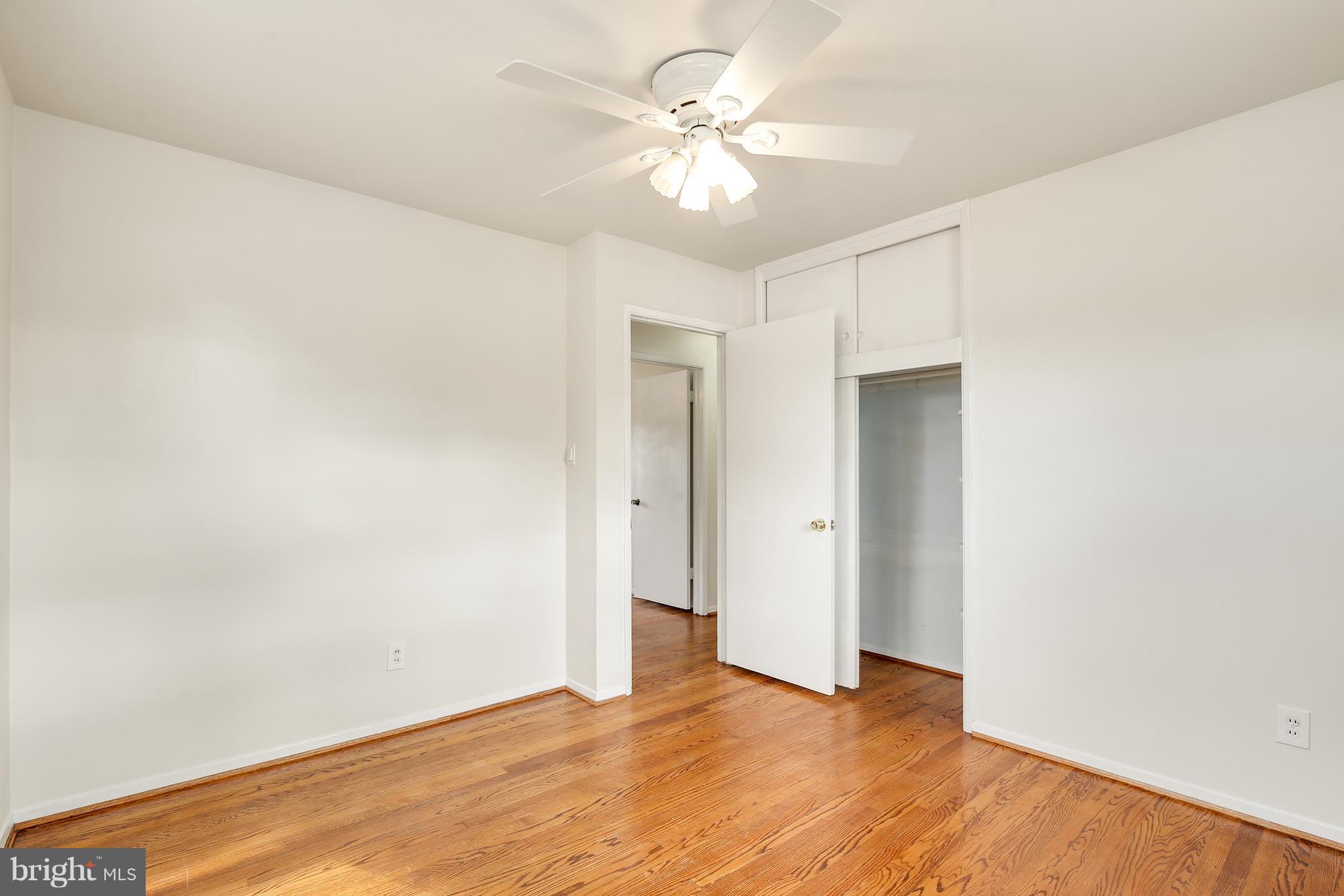 7515 Gresham Street Springfield, VA 22151 - Photo 17 of 36 a view of an empty room with window and a ceiling fan
