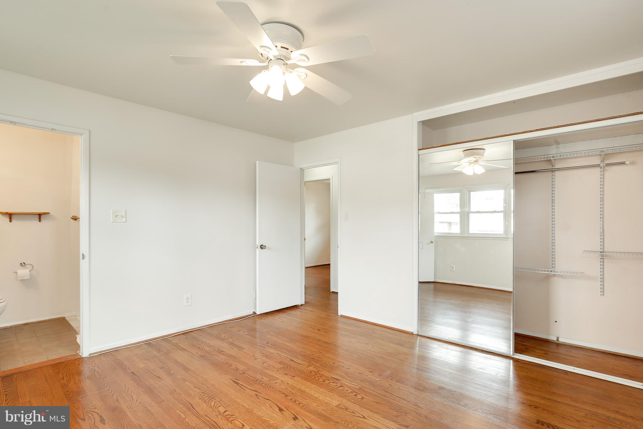 7515 Gresham Street Springfield, VA 22151 - Photo 19 of 36 wooden floor in an empty room with a window