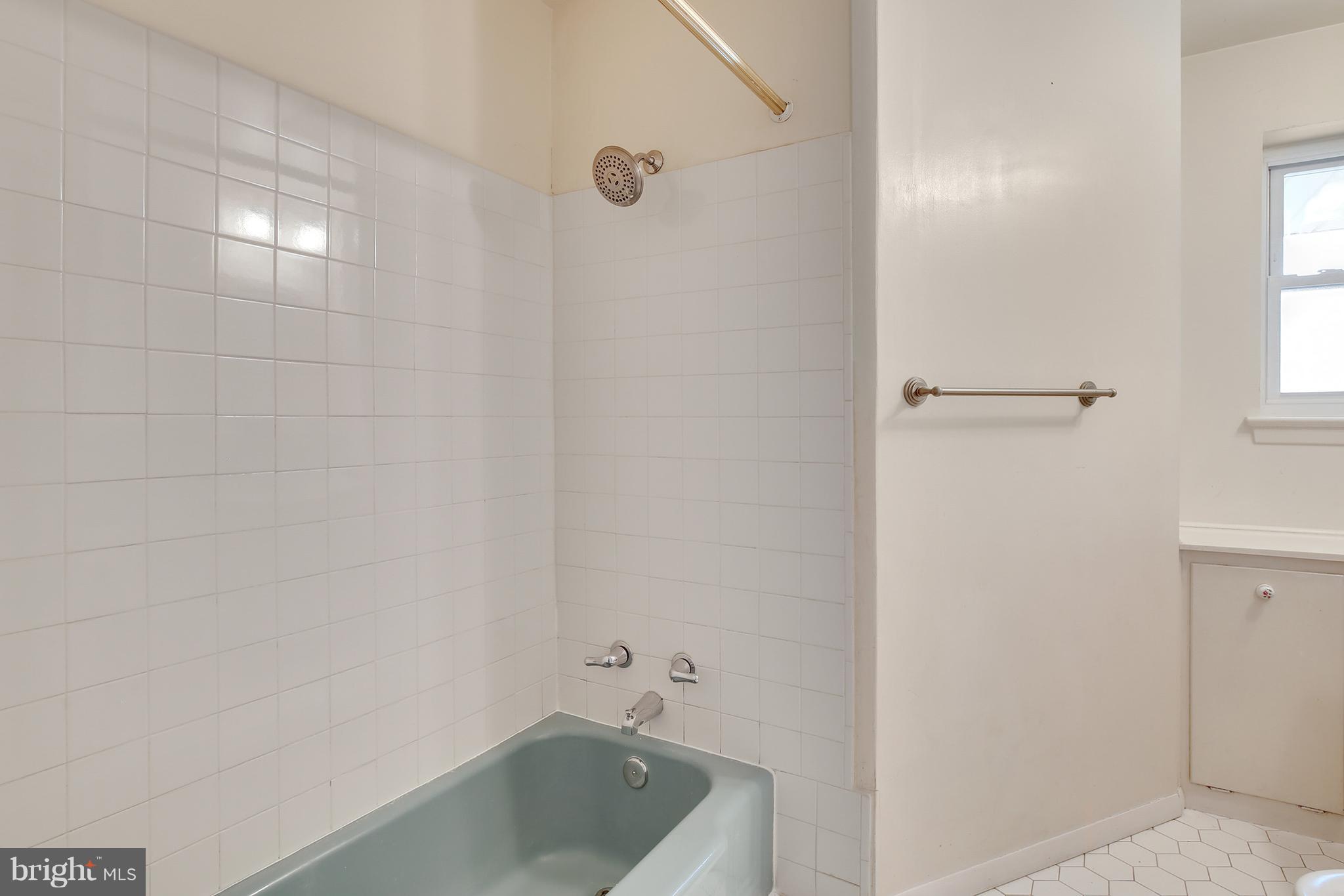 7515 Gresham Street Springfield, VA 22151 - Photo 23 of 36 a bathroom with a tub