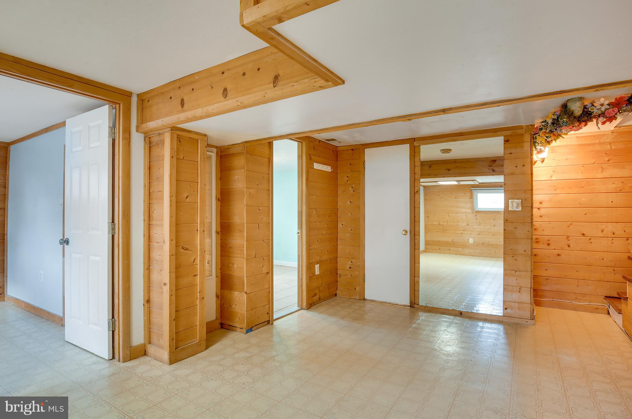 7515 Gresham Street Springfield, VA 22151 - Photo 25 of 36 a view of hallway with a large window and wooden floor