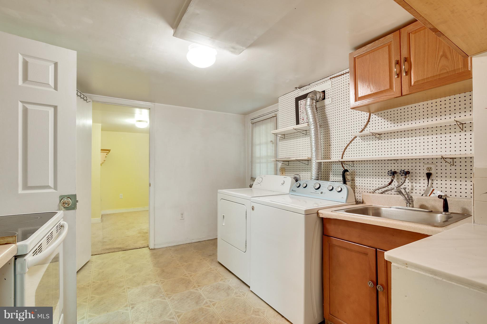 7515 Gresham Street Springfield, VA 22151 - Photo 30 of 36 a utility room with dryer and washer