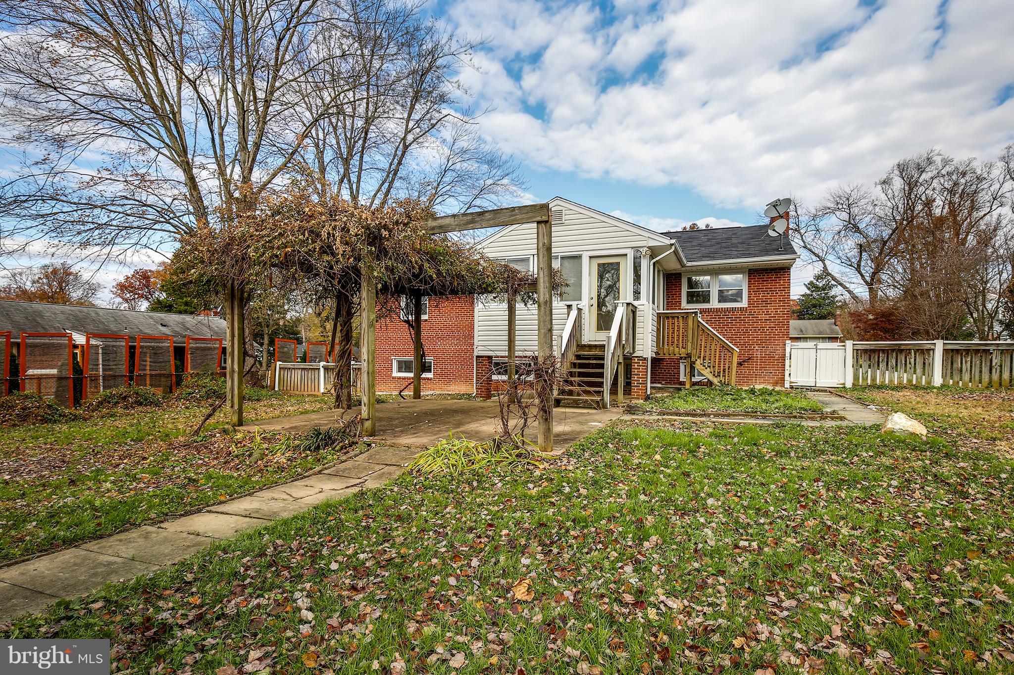 7515 Gresham Street Springfield, VA 22151 - Photo 34 of 36 a view of a house with a yard