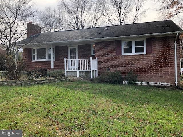 7515 Gresham Street Springfield, VA 22151 - Photo 36 of 36 a view of a house with a yard and a large tree