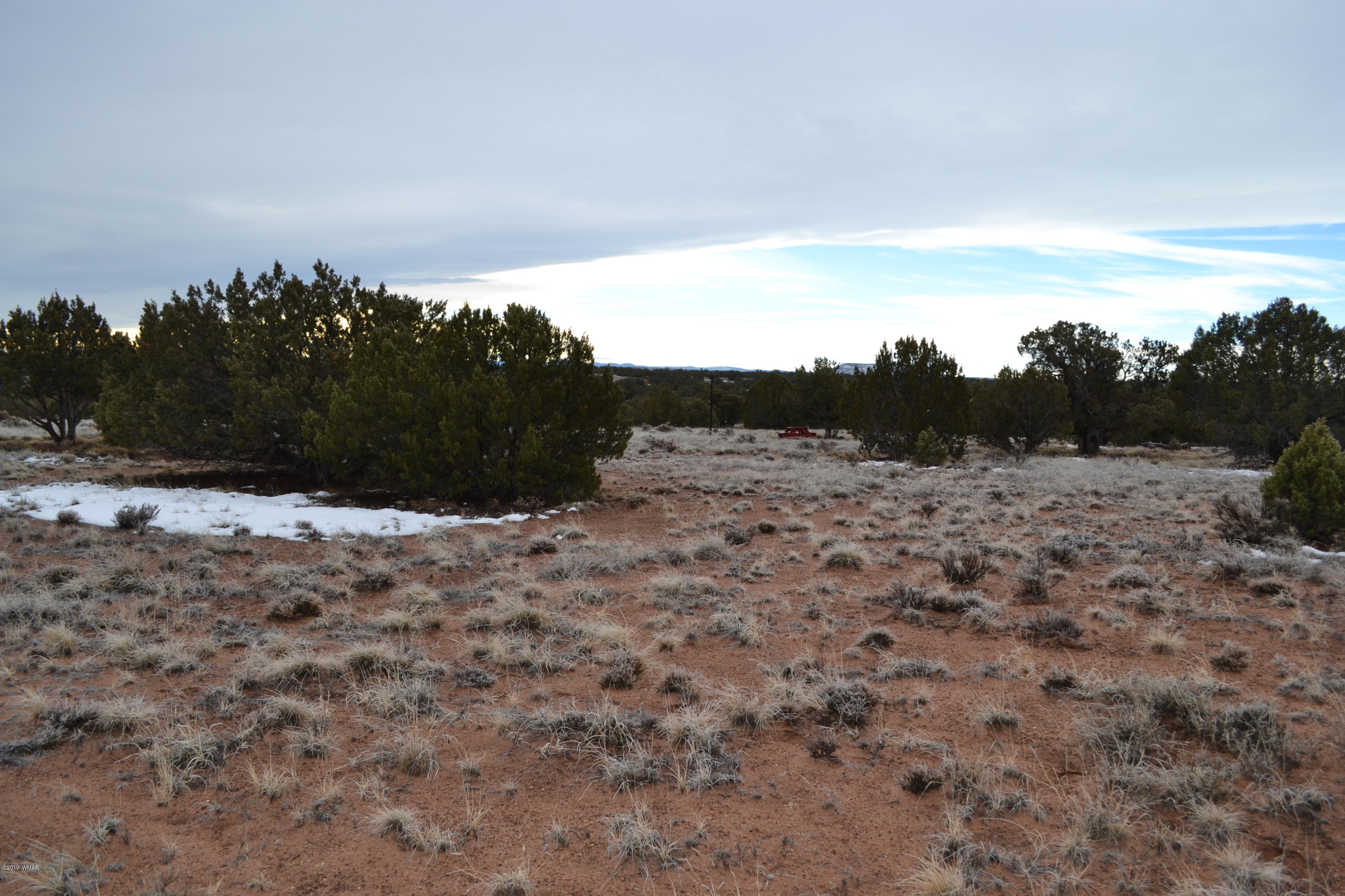 9157 Concho Az 85924 Concho, AZ 85924 - Photo 1 of 19 a view of a dry yard with wooden fence