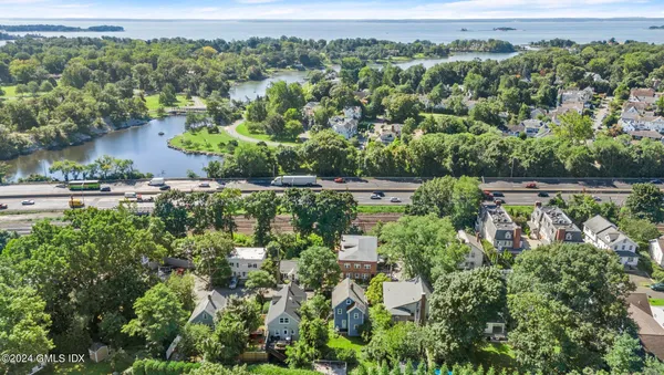 an aerial view of a house with a yard