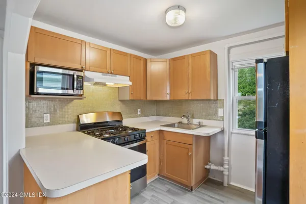 a kitchen with a stove and a sink