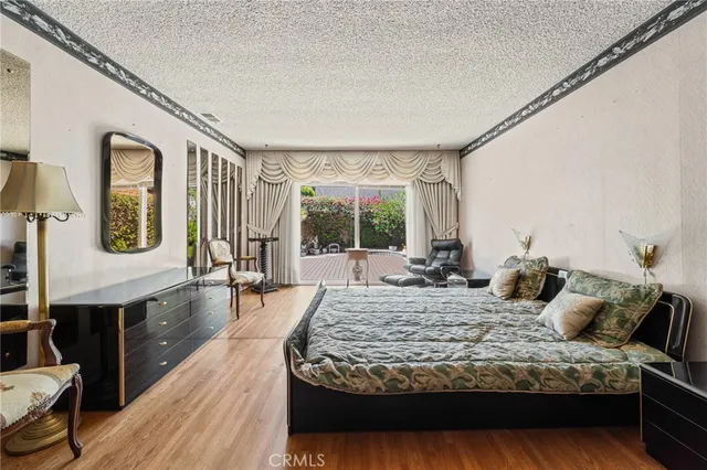 a view of living room and kitchen with wooden floor