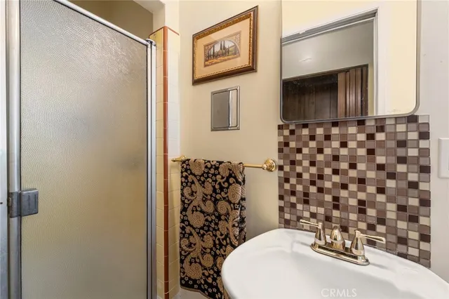 a bathroom with a sink and a mirror