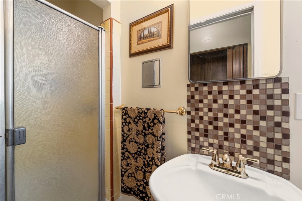 233 South Swall Drive Beverly Hills, CA 90211 - Photo 22 of 28 a bathroom with a sink and a mirror