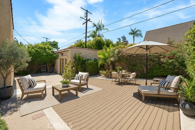 233 South Swall Drive Beverly Hills, CA 90211 - Photo 23 of 28 a view of a patio with couches and umbrella