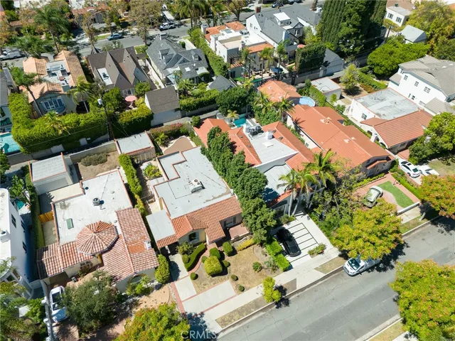 an aerial view of residential house with outdoor space and parking