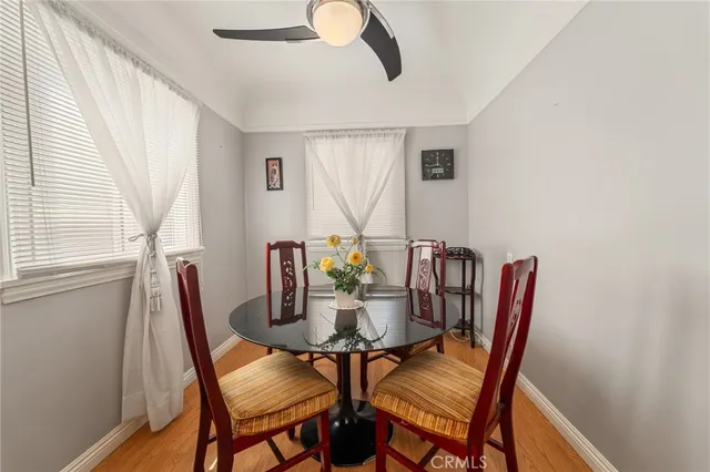 a view of a dining room with furniture and window
