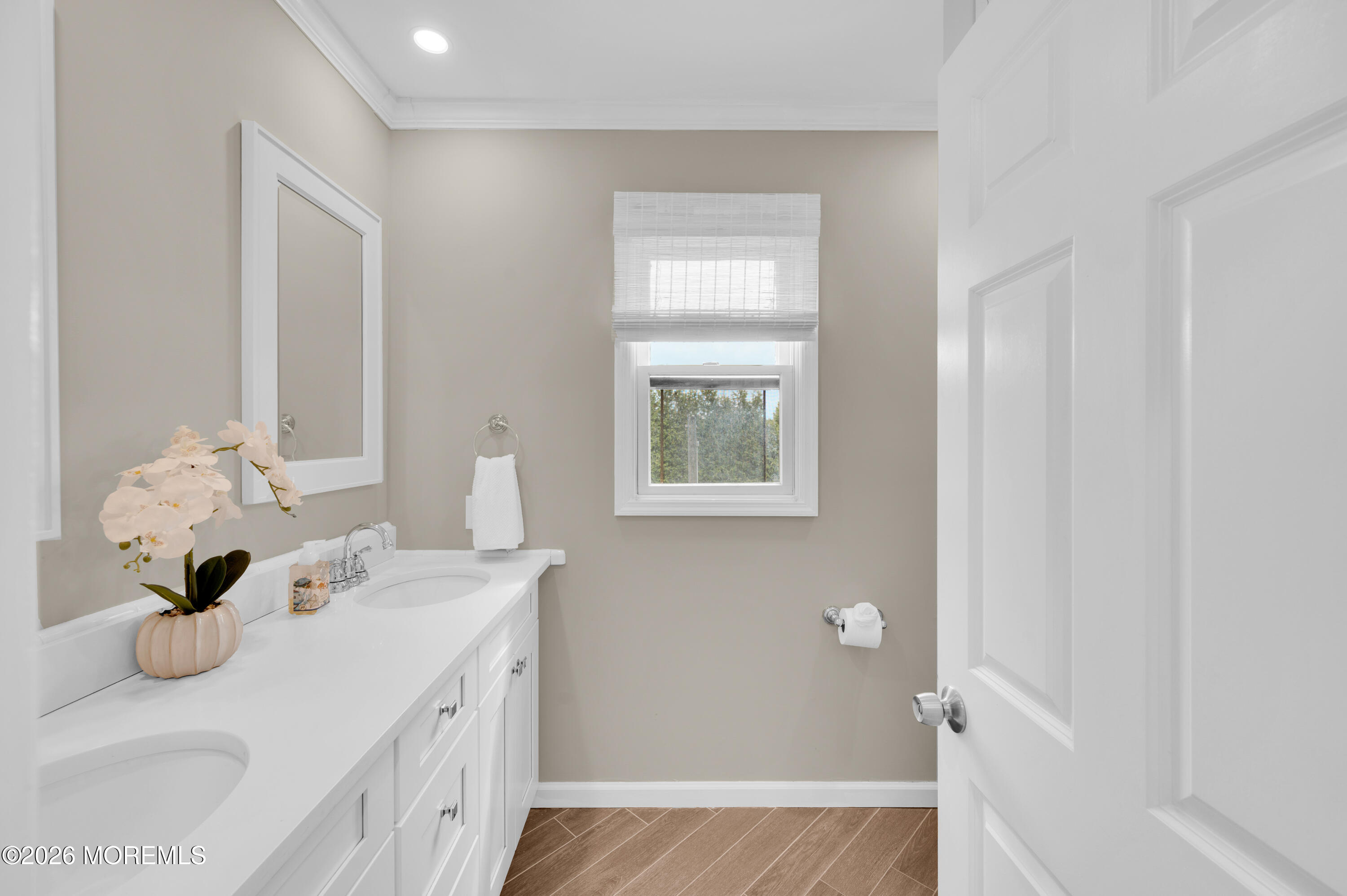 41 A Mount Street Bay Head, NJ 08742 - Photo 19 of 33 a bathroom with a sink a mirror and a window