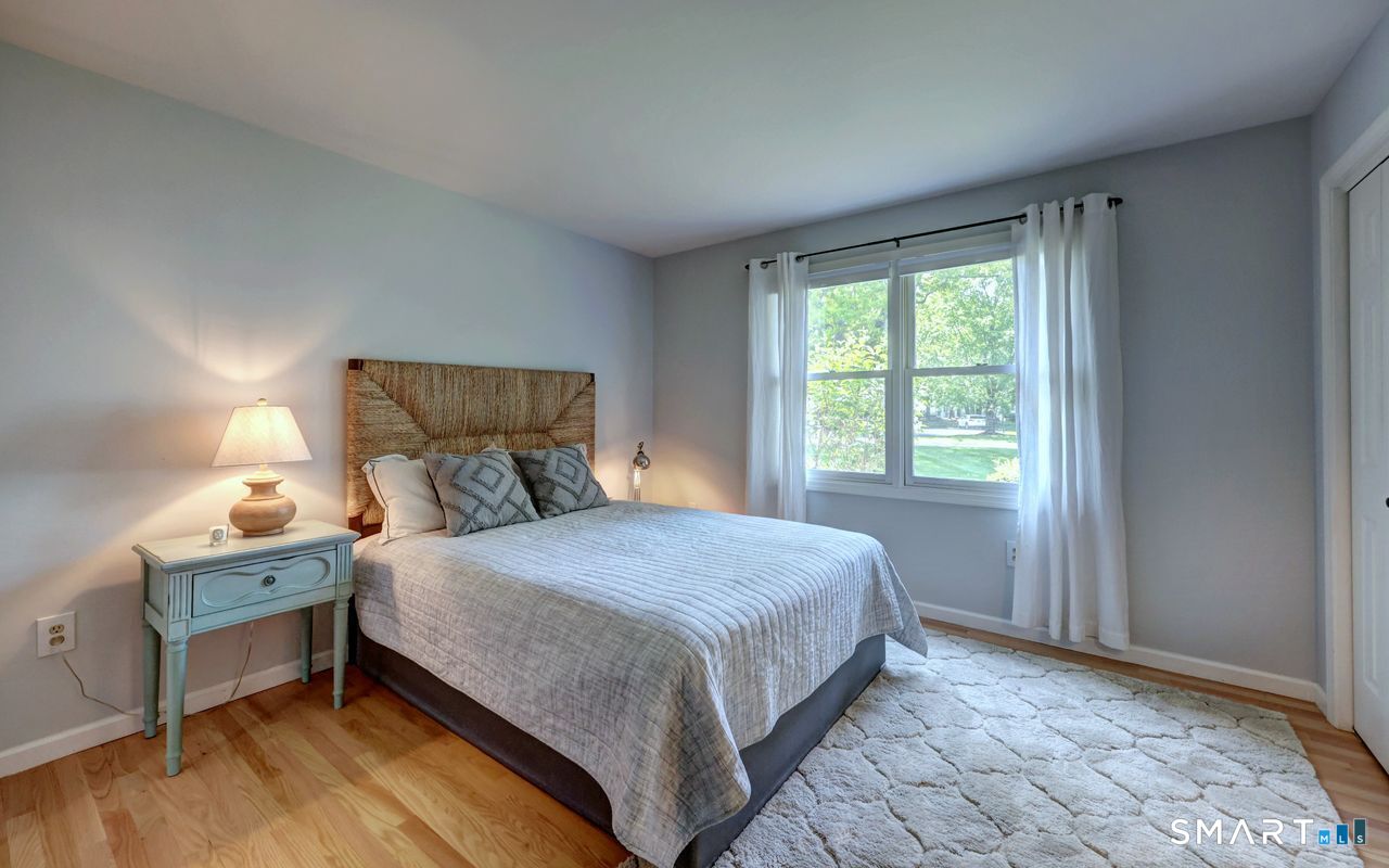 9 Canterbury Road, Unit 9 Hamden, CT 06514 - Photo 17 of 29 a bedroom with a bed and a window