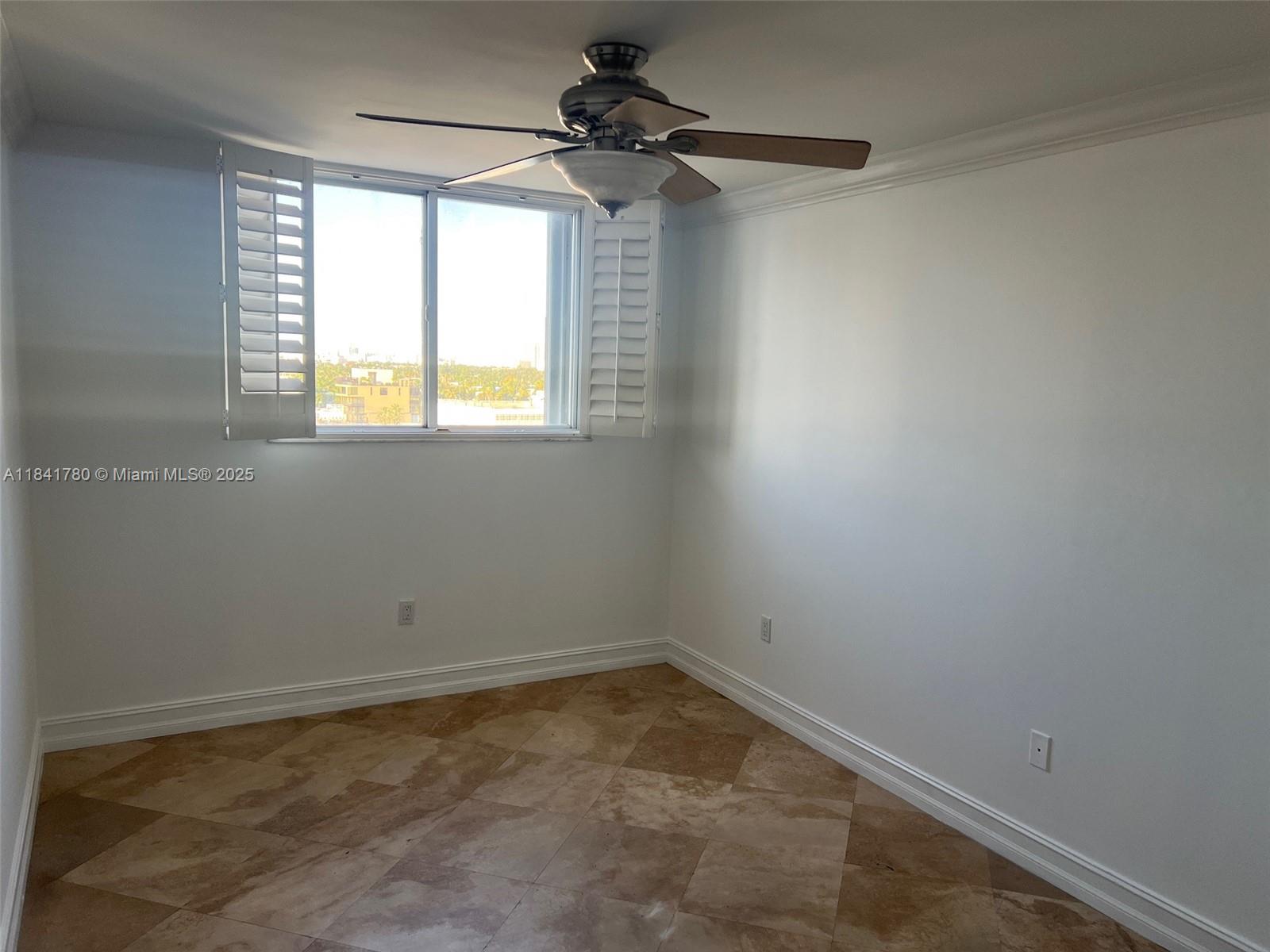 1688 West Avenue, Unit 1005 Miami Beach, FL 33139 - Photo 17 of 34 an empty room with a window