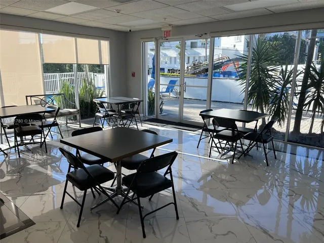 a dining room with furniture window and outside view