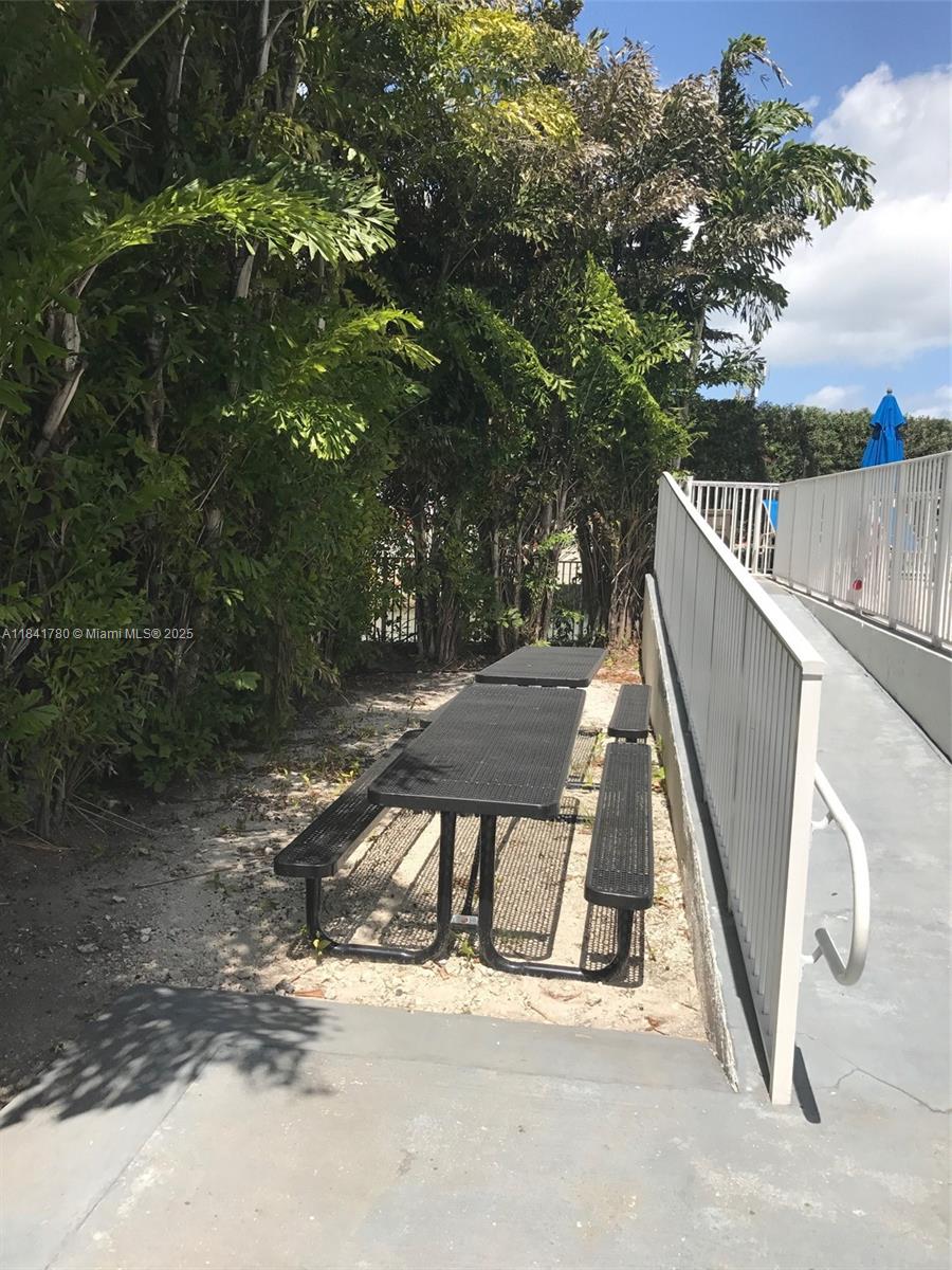 1688 West Avenue, Unit 1005 Miami Beach, FL 33139 - Photo 24 of 34 a view of deck with wooden floor and fence