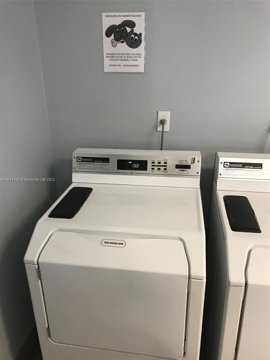 1688 West Avenue, Unit 1005 Miami Beach, FL 33139 - Photo 25 of 34 a utility room with dryer and washer