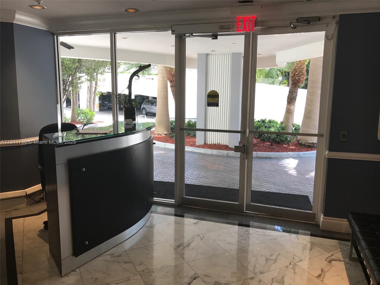1688 West Avenue, Unit 1005 Miami Beach, FL 33139 - Photo 28 of 34 a view of a hallway with wooden floor and door