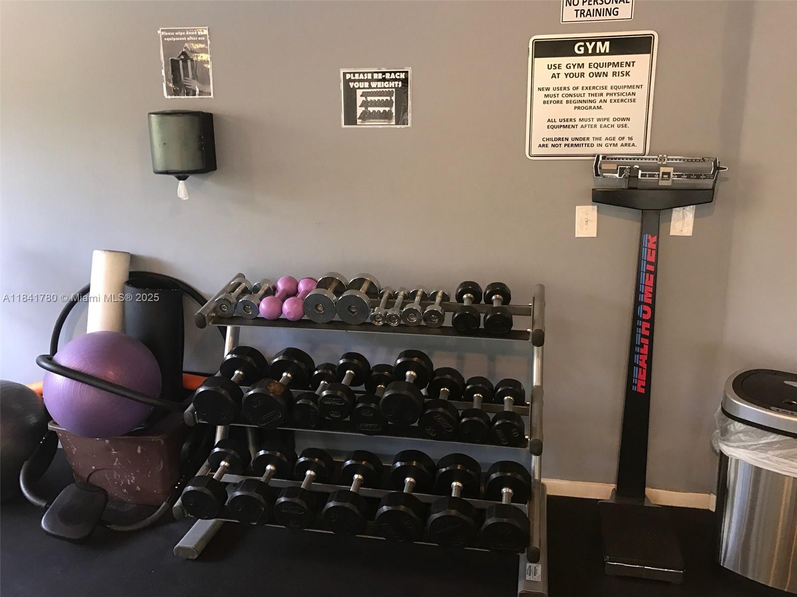 1688 West Avenue, Unit 1005 Miami Beach, FL 33139 - Photo 31 of 34 a room with lots of different colored cloths