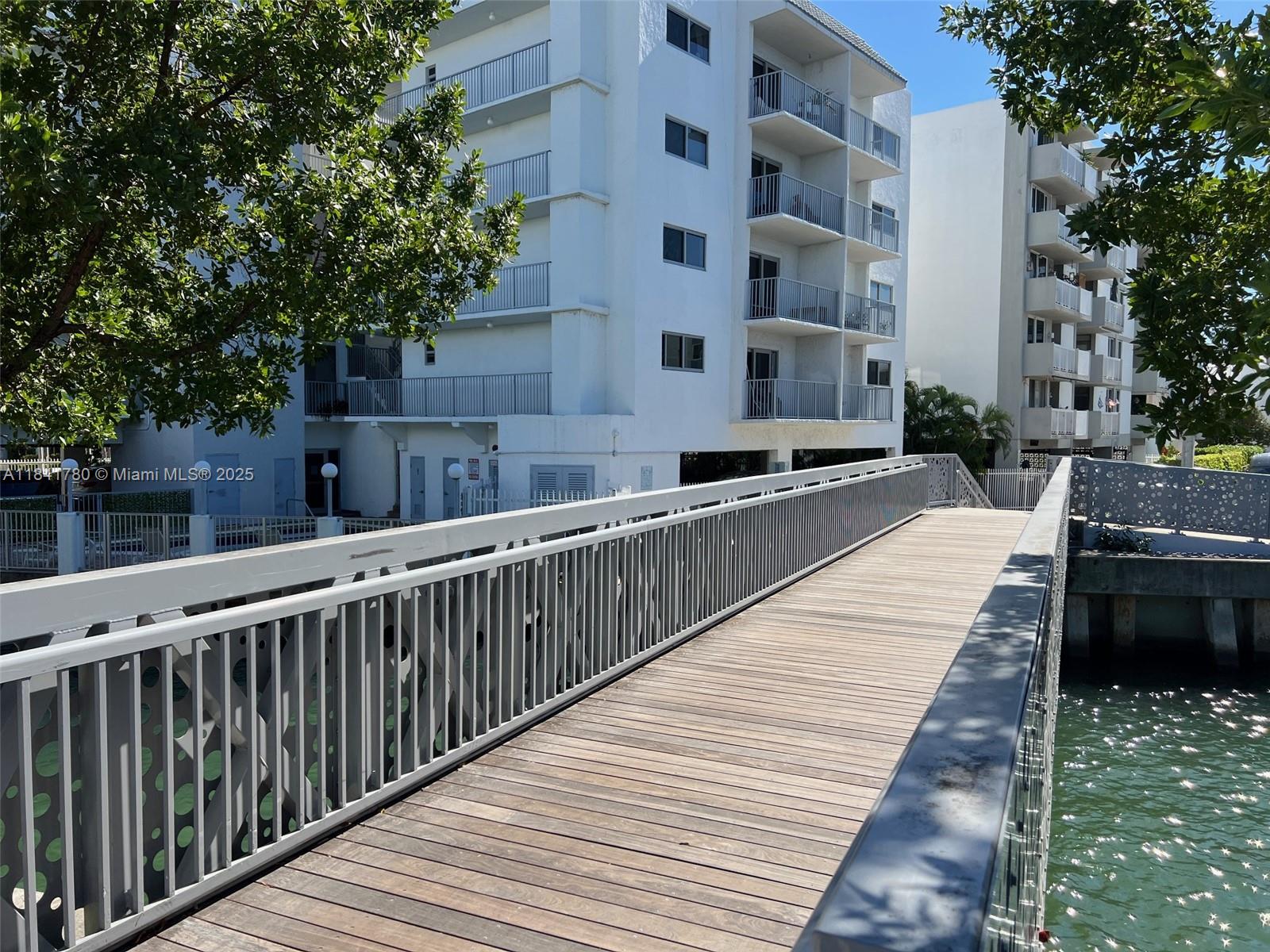 1688 West Avenue, Unit 1005 Miami Beach, FL 33139 - Photo 34 of 34 a view of balcony with two chairs and a fire pit